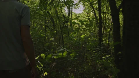 Man walking through the thickets of the forest 스톡 동영상 140766552