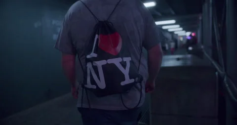 Man Walking Through Time Square Stock Footage 242813670