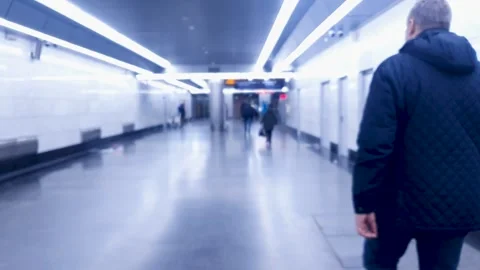 Man is walking through an underpass in the subway. Movement of people Stock Footage 297698838