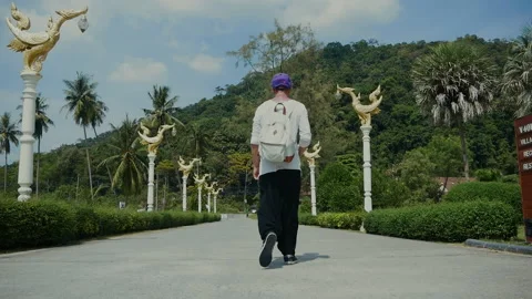 Man walking throw beatiful thailand road Stock Footage 167162789