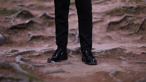 Man walking throw mountain road with roots Stock Footage 116994729