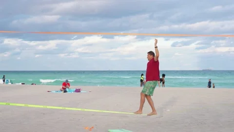 Man Walking On Tight Rope at the Beach Stock-Footage 158345266
