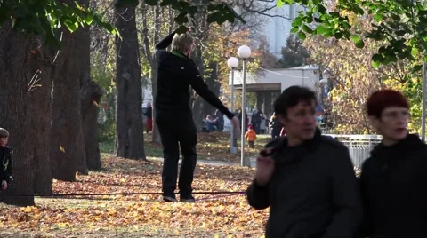 Man walking on a tightrope Stock-Footage 45990375