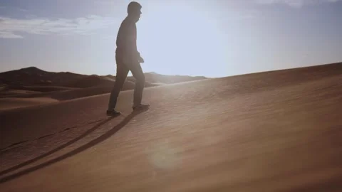 Man walking on the top of the sand dunes of the Thar desert Stock Footage 285744501