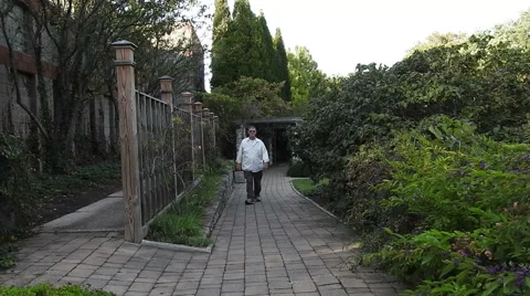 Man walking toward the camera in a nature park 動画素材 55525195