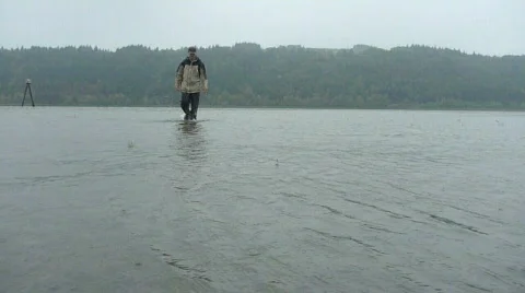 Man Walking Toward Camera on River Video stock 875134