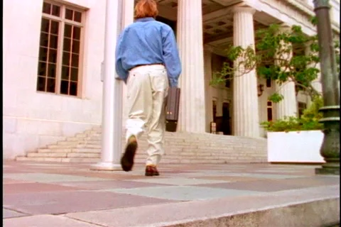 Man walking toward courthouse steps. Stock Footage 974065