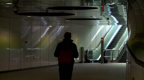 Man walking toward escalator of metro station Stock Footage 42491176