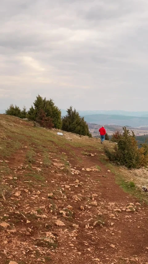 Man walking toward Uvac River viewpoint Serbia travel adventure concept Stock Footage 332230962