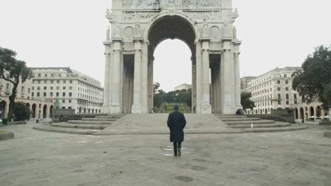 Man walking towards Arco della Vittoria (Victory Arch) in Genoa, Italy Stock Footage 150069025