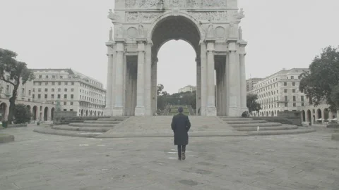 Man walking towards Arco della Vittoria (Victory Arch) in Genoa, Italy Stock Footage 150073260