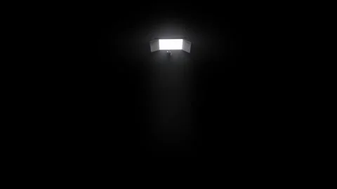 Man Walking Towards Bright Light Door in Dark Room Stock Footage 322000178