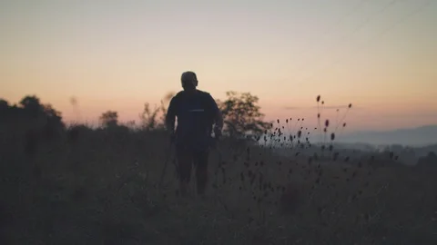 Man Walking Towards The Camera Early In The Morning Before Sunrise Stock Footage 93660828