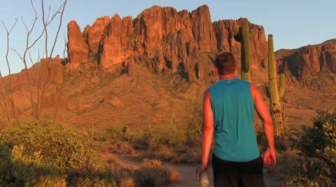 Man walking towards mountain. 스톡 동영상 24811745