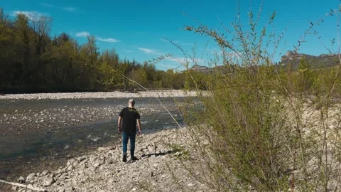 Man Walking Towards Mountain River - Back View Adventure Journey 스톡 동영상 332242335