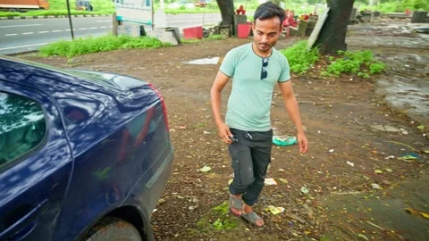 Man walking towards the shop ensuring car is locked Stock Footage 297600106