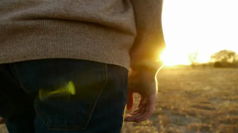 Man Walking Towards Sun Stock-Footage 33306213