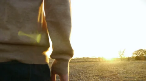 Man Walking Towards Sun, Slow Motion, Color Corrected Video stock 33309598