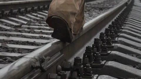 Man walking on the tracks. bare trees autumn Stock Footage 58149620