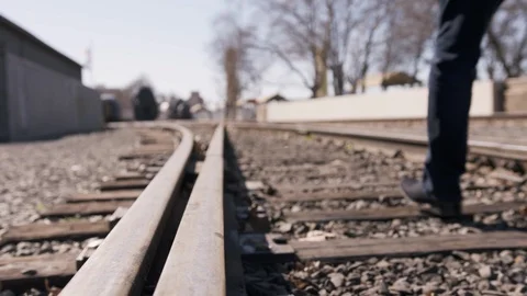 Man Walking On Tracks Stock Footage 105318869