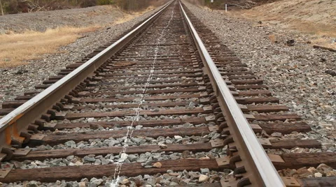 Man walking on train tracks 動画素材 932416