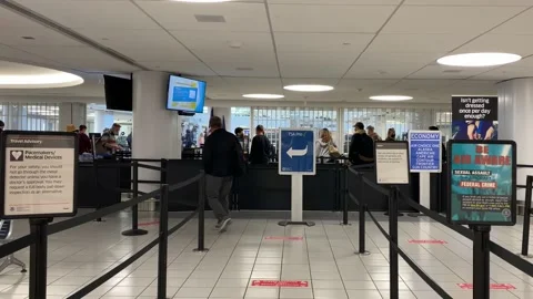 A man walking up to the TSA area Stock Footage 140683952