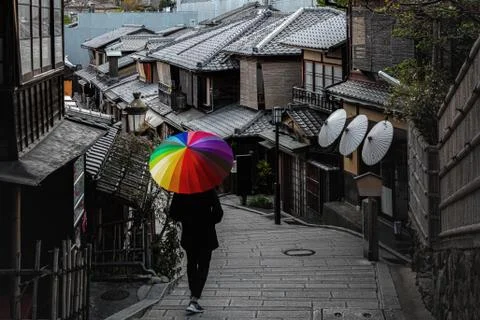 Man walking in umbrella area in Higashiyama Known as Ninen-zaka, it is Kyoto' Stock Photos