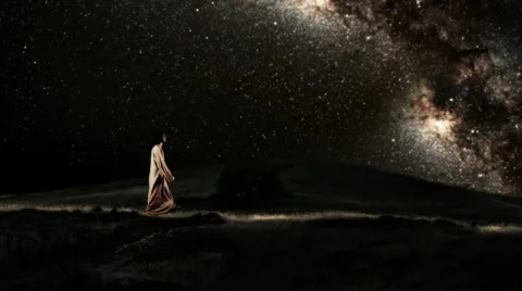 Man walking under the starry sky at night Stockbeeldmateriaal 49842902