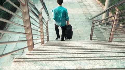 Man Walking Upstairs with a Briefcase Stock Footage 314665783