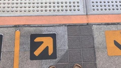 A man walking for wait train be behind yellow line at BTS station Stock Footage 111564876