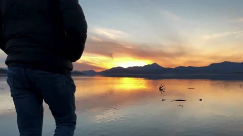 Man walking on water at sunset. Stock Footage 223367503