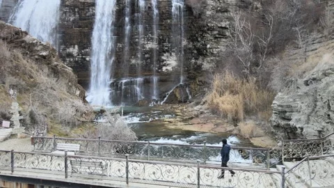 Man walking waterfall Stock Footage 263524938