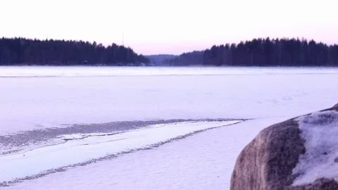 Man walking on weak ice of a freezing lake Stock Footage 70176983