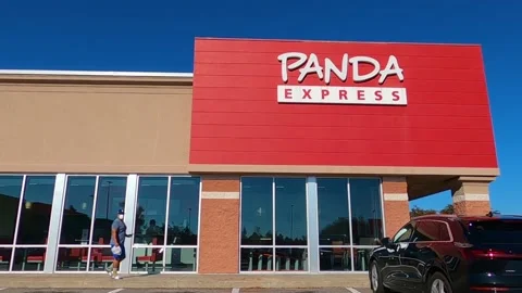 Man walking wearing face mask outside of Panda Express Stock Footage 143123356