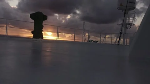 Man walking on the wheelhouse top deck upper bridge deck of the huge cargo Vidéo 169731811