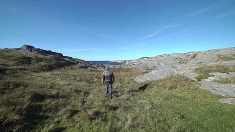 Man walking. Wide shot. Stock Footage 77974284