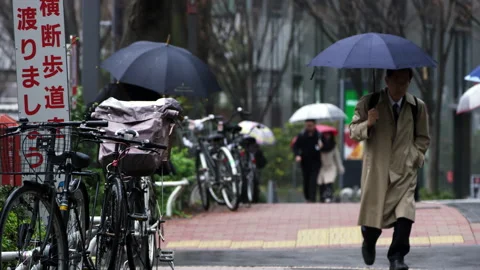 Man Walking To Work In Rain Tokyo Japan Slow Motion Stock Footage 163229875