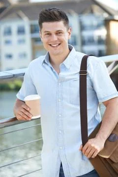 Man Walking To Work In Urban Setting Stock Photos