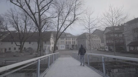 A man walks across the bridge Stock Footage 264817044