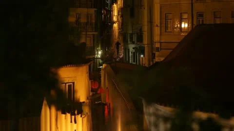 Man walks across empty Alfama district Stock-Footage 12605717