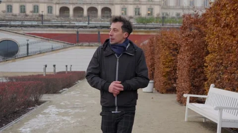 Man walks alone in the cold after being stood up for a date or meeting Stock Footage 311193136