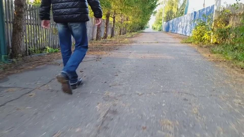 Man walks along the asphalt Video stock 80419035