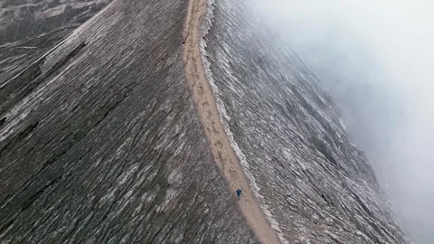 A man walks along the caldera of the active volcano Bromo. Java Island 스톡 동영상 251658972