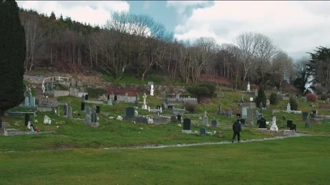 A man walks along the old Catholic cemetery, drone footage from above Stock-Footage 234111117