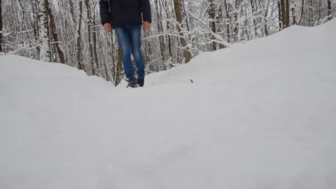 A man walks along the winter road, the camera - view from below. close-up Stock Footage 101099729
