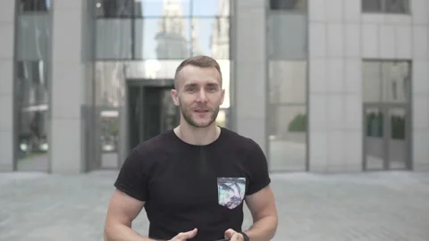 A man walks and speaks to the camera Stock Footage 113405535