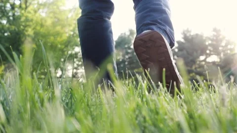 A man walks around at sunset Stock Footage 130987907