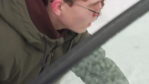 Man Walks Away After Closing Car Door on Cold Winter Day Video stock 310178731