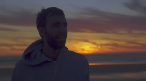 Man walks away from sunset Stock Footage 59988682