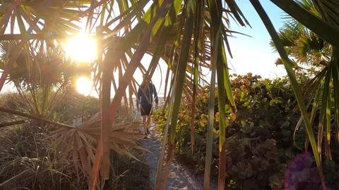 Man walks back from the beach Stock Footage 171949125